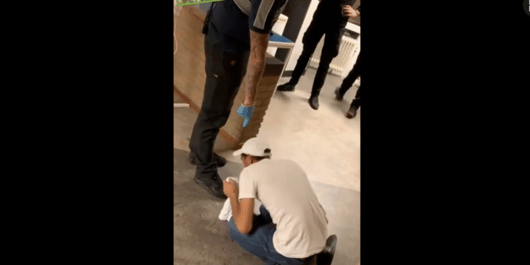 Security guard filmed ordering asylum seeker to kiss his shoes